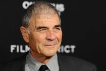 In this Monday, March 18, 2013 file photo, Robert Forster arrives at the LA premiere of "Olympu ...