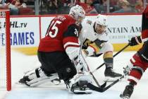 Arizona Coyotes goaltender Darcy Kuemper (35) makes a save on a shot by Vegas Golden Knights le ...