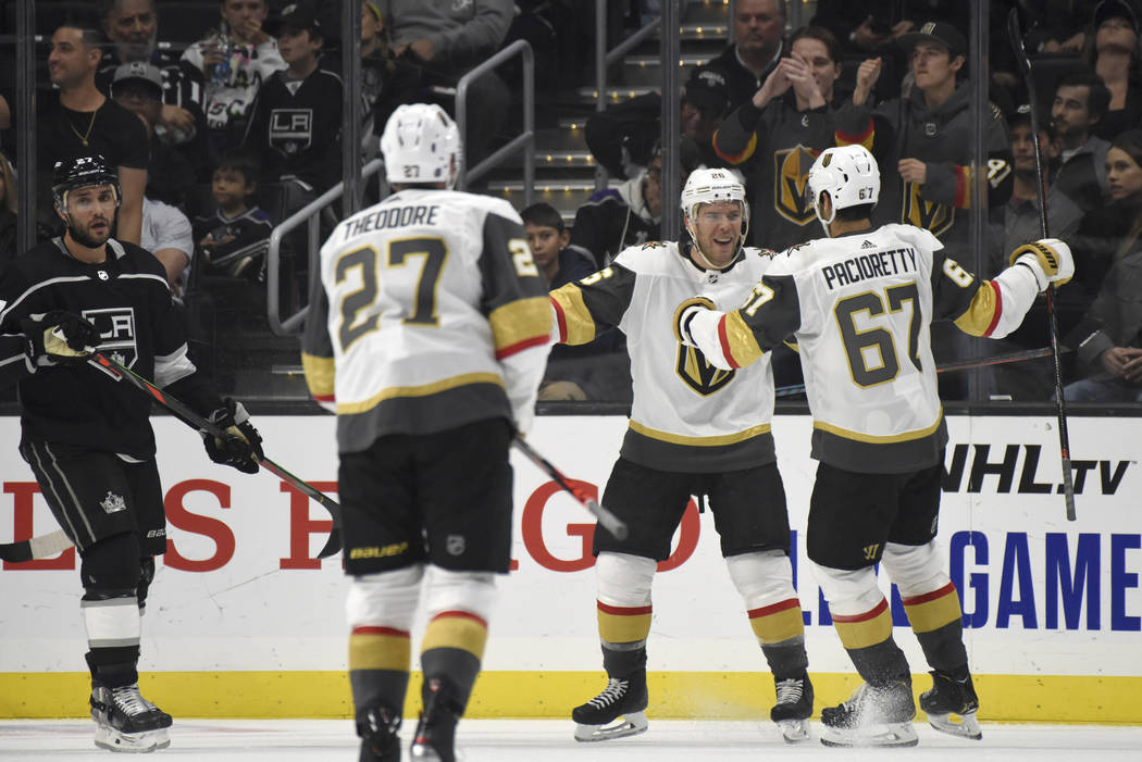 Vegas Golden Knights center Paul Stastny, center, is congratulated after scoring against the Lo ...