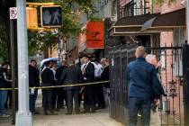 NYPD investigates the scene of a shooting in the Brooklyn borough of New York on Saturday, Oct. ...