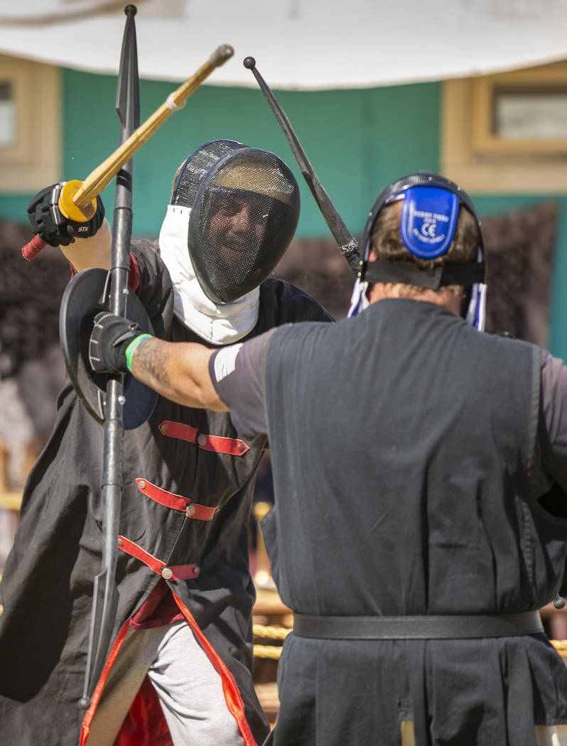 Gideon the Knight, left, practices his swordsmanship with Ulrich Spearbreaker as part of the Em ...