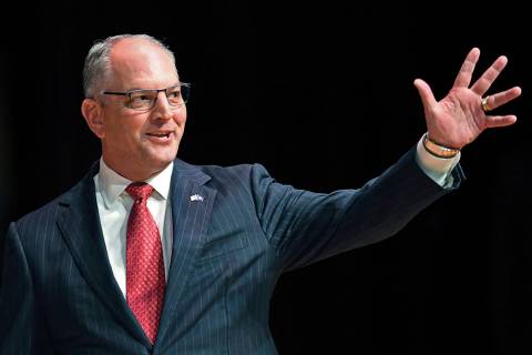 FILE - In this Sept. 19, 2019, file photo, Gov. John Bel Edwards acknowledges his supporters as ...