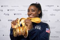 Simone Biles of the United States shows her five gold medals at the Gymnastics World Championsh ...