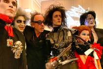 Tim Burton, third from left, poses with, from left, Gary Lewandowski of Los Angeles, Rick Decar ...