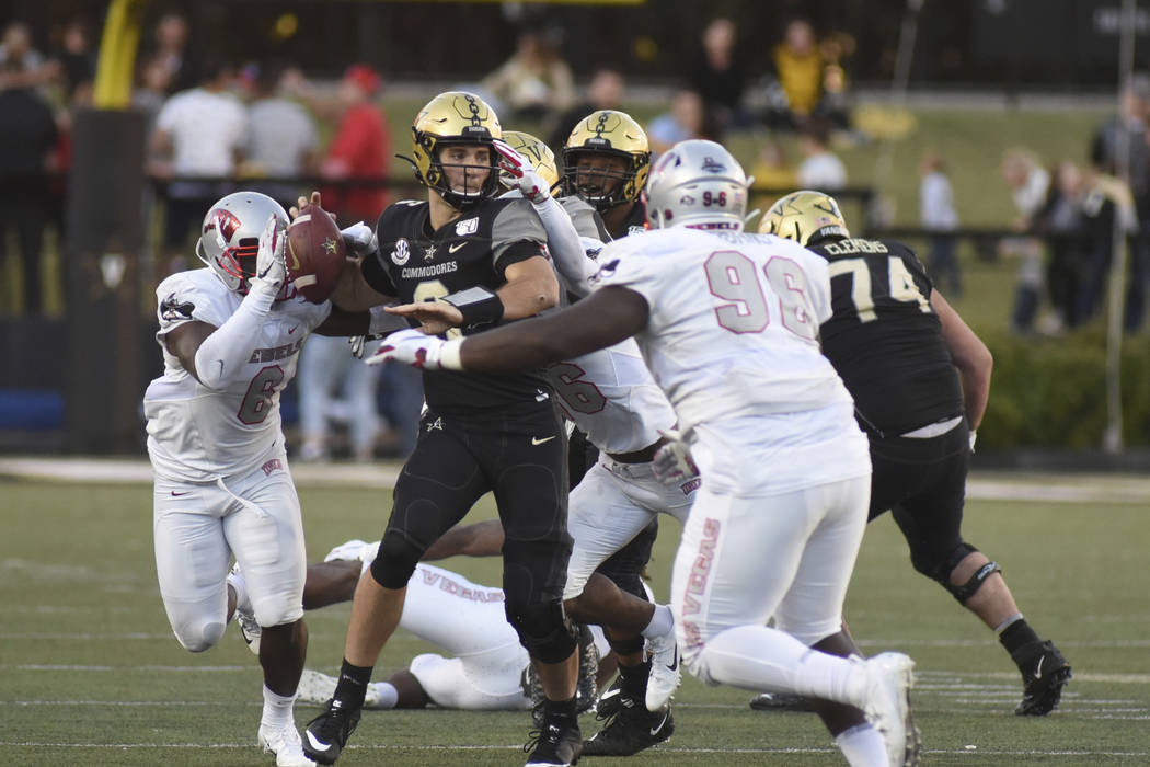 Vanderbilt quarterback Riley Neal (6) is pressured by the UNLV defense in the second half of an ...