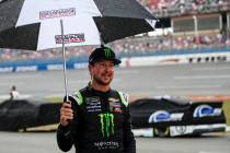 Kurt Busch walks back to garage during a rain delay at a NASCAR Cup Series auto race at Tallade ...