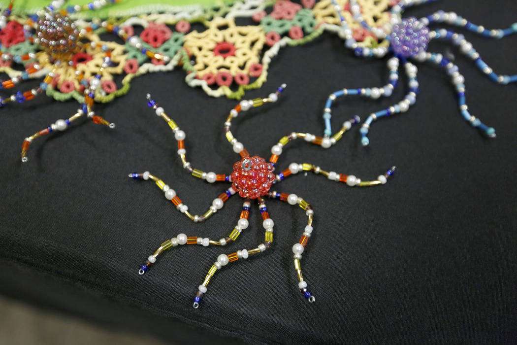 Karen Byrne, 74, of Third Eye Gifts in Las Vegas sells her beaded artworks during Mystic Fair a ...