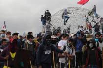 Anti-government protesters face off with police near the National Assembly during a military cu ...