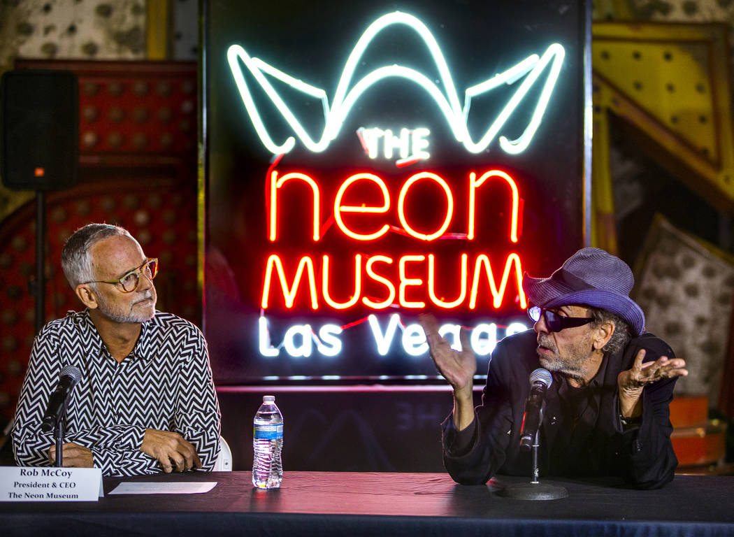 Director and artist Tim Burton, right, speaks to Neon Museum President & CEO Rob McCoy abou ...