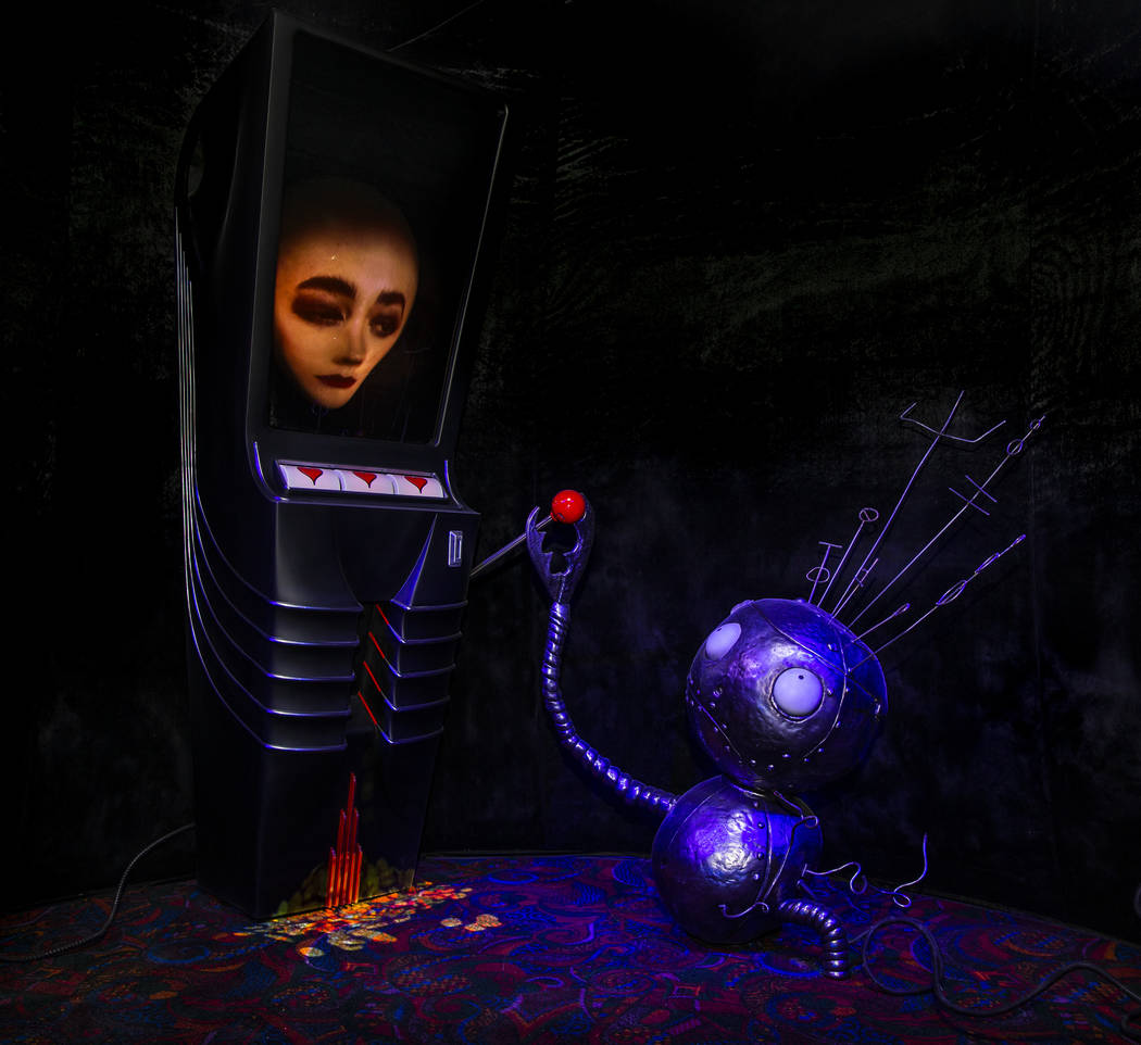 Art piece "Robot Boy and Slot Machine" by Tim Burton in his Lost Vegas art exhibition ...