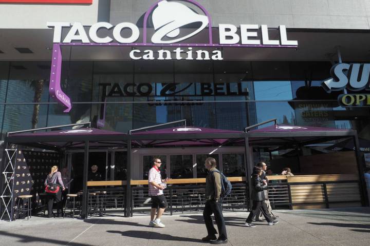 Pedestrians walk by the new Taco Bell Cantina in the Harmon Center in Las Vegas, Monday, Nov. 1 ...