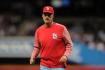 St. Louis Cardinals pitching coach Mike Maddux is seen on the field after a meeting with starti ...