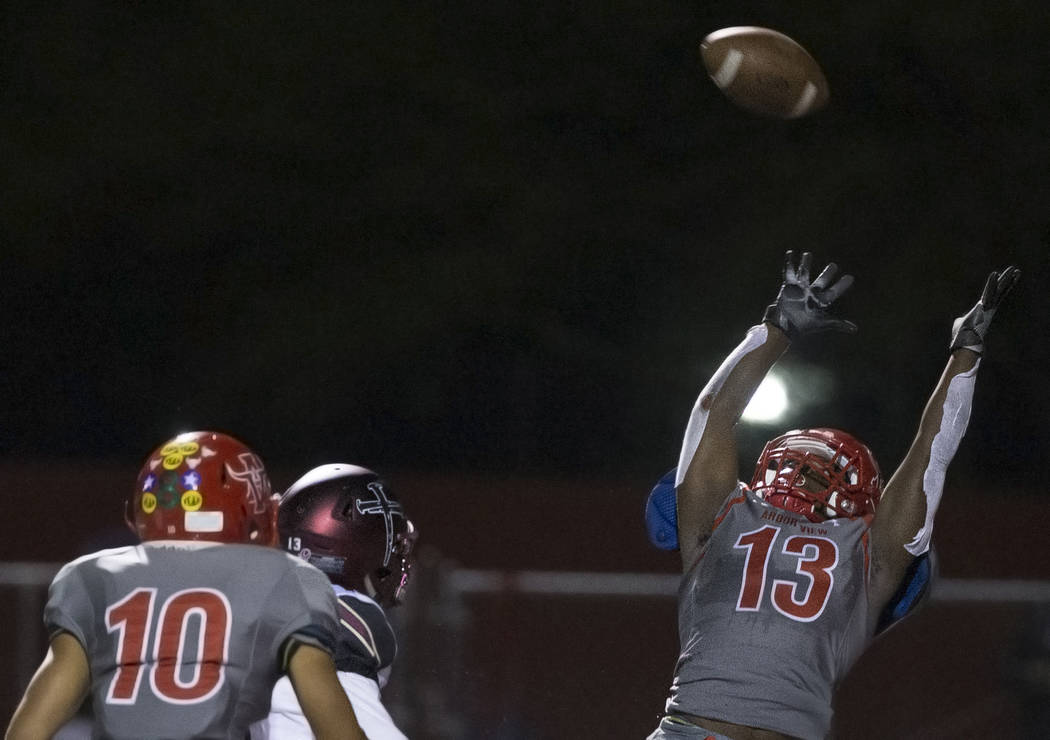 Arbor View sophomore defensive back D'Andre Washington (13) leaps to try and make an intercepti ...