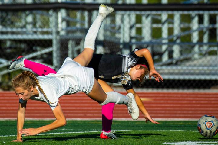 Arbor View's Abby Cassano (6, left) and Faith Lutheran's Camille Longabardi (6) collide over th ...