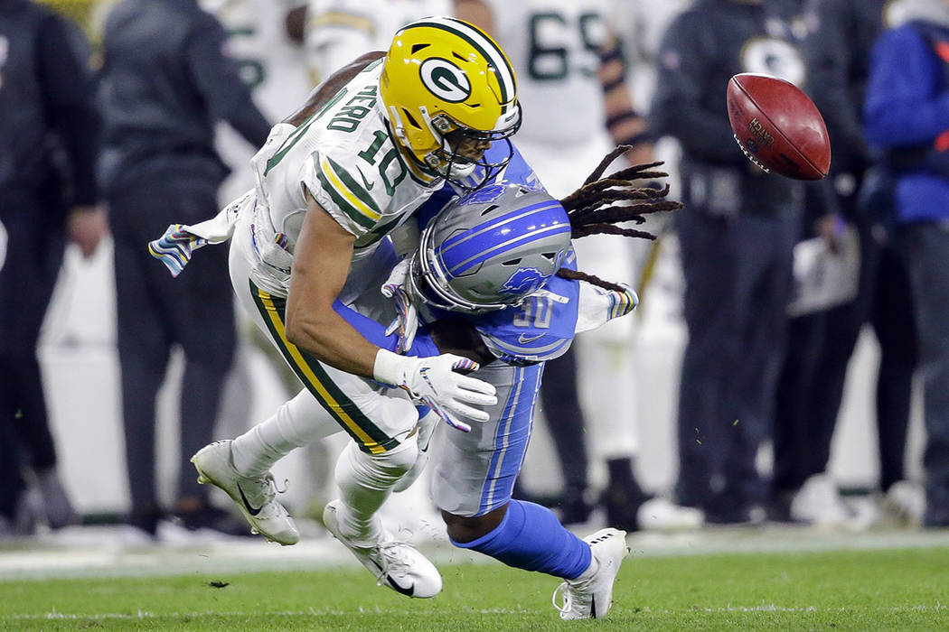 Green Bay Packers wide receiver Darrius Shepherd (10) fumbles a punt after getting hit by Detro ...