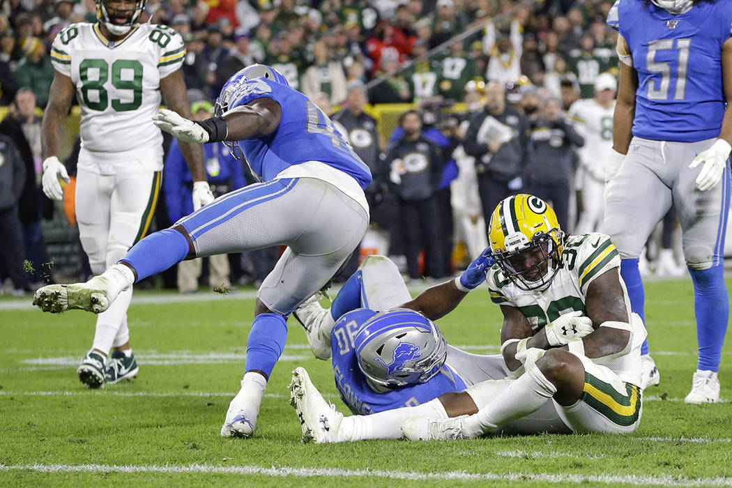 Green Bay Packers running back Jamaal Williams (30) stops short of the goal line to keep the c ...