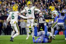 Green Bay Packers kicker Mason Crosby (2) celebrates scoring the winning field goal with punter ...