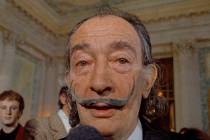 FILE - In this May 21, 1973 file photo, Spanish surrealist painter Salvador Dali, presents his ...