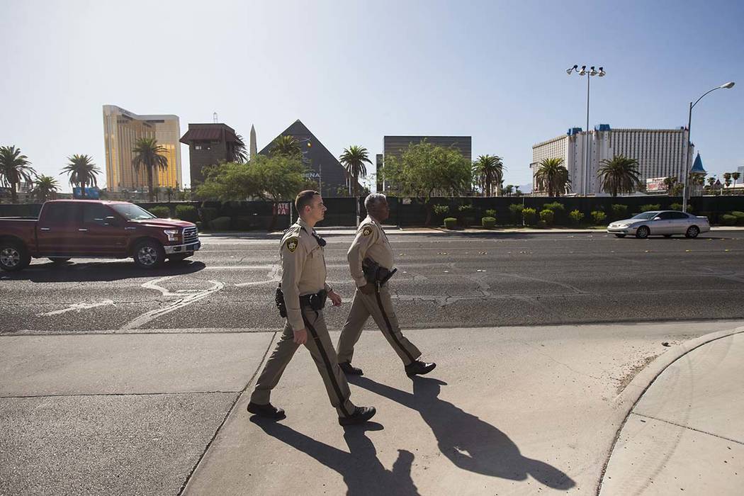 Las Vegas police officer Brandon Engstrom, left, and George Gafford, who works in Metro's Polic ...