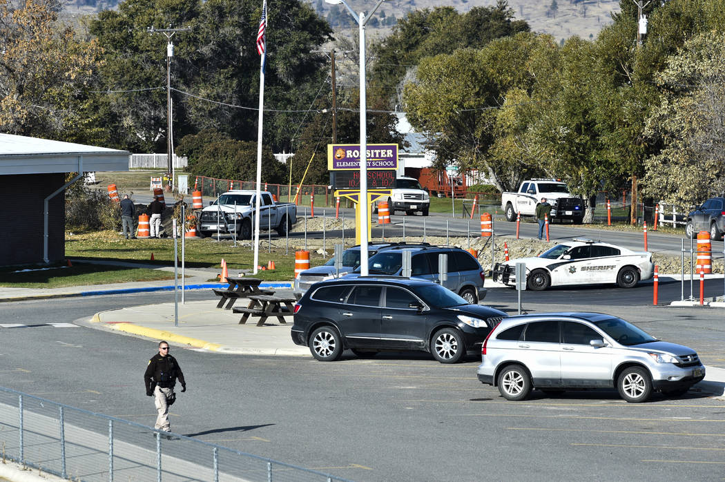 The Lewis and Clark County bomb squad works the scene at Rossiter Elementary school Tuesday, Oc ...