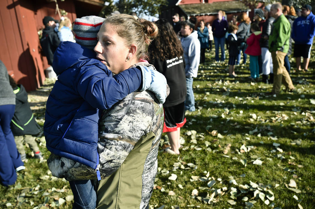 Marnie Wedgwood hugs her son after an improvised explosive device detonated on the Rossiter Ele ...
