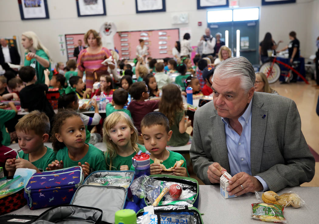 Gov. Steve Sisolak has lunch with Cade Christafaris, 5, from left, Elizabeth Belger, 5, Zoe Zad ...