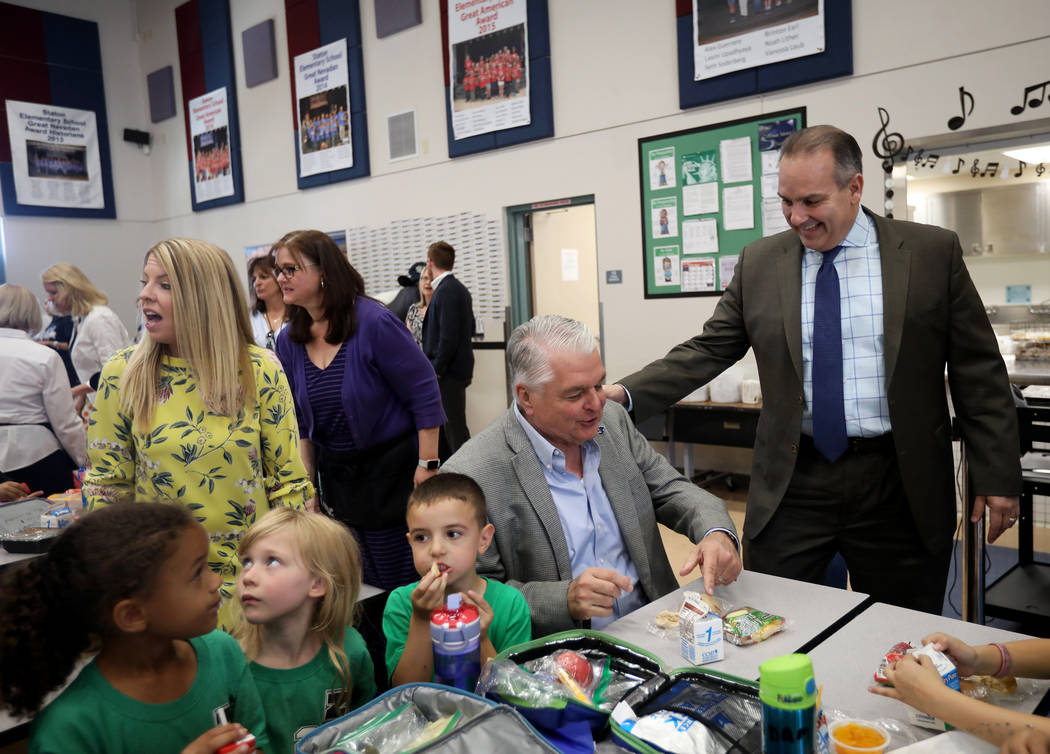 Clark County School District Superintendent Jesus Jara, right, greets Gov. Steve Sisolak as he ...