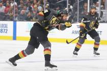 Golden Knights defenseman Nicolas Hague (14) shoots on goal during the first period of Vegas' N ...