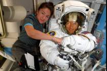 FILE - In this image released Friday, Oct. 4, 2019, by NASA, astronauts Christina Koch, right, ...