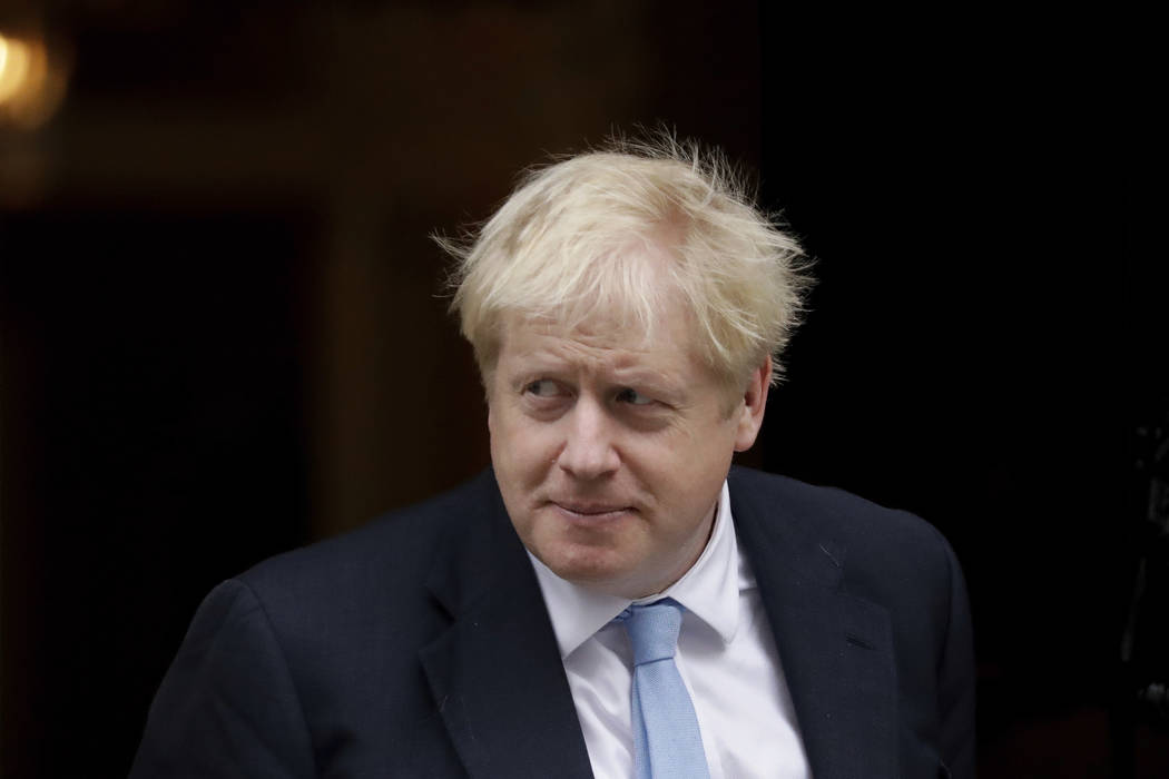British Prime Minister Boris Johnson walks out to greet NATO Secretary General Jens Stoltenberg ...