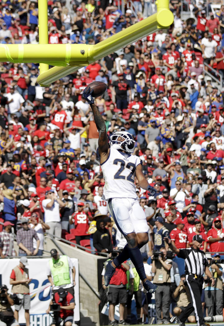 Los Angeles Rams cornerback Marcus Peters (22) jumps after intercepting a pass in the end zone ...