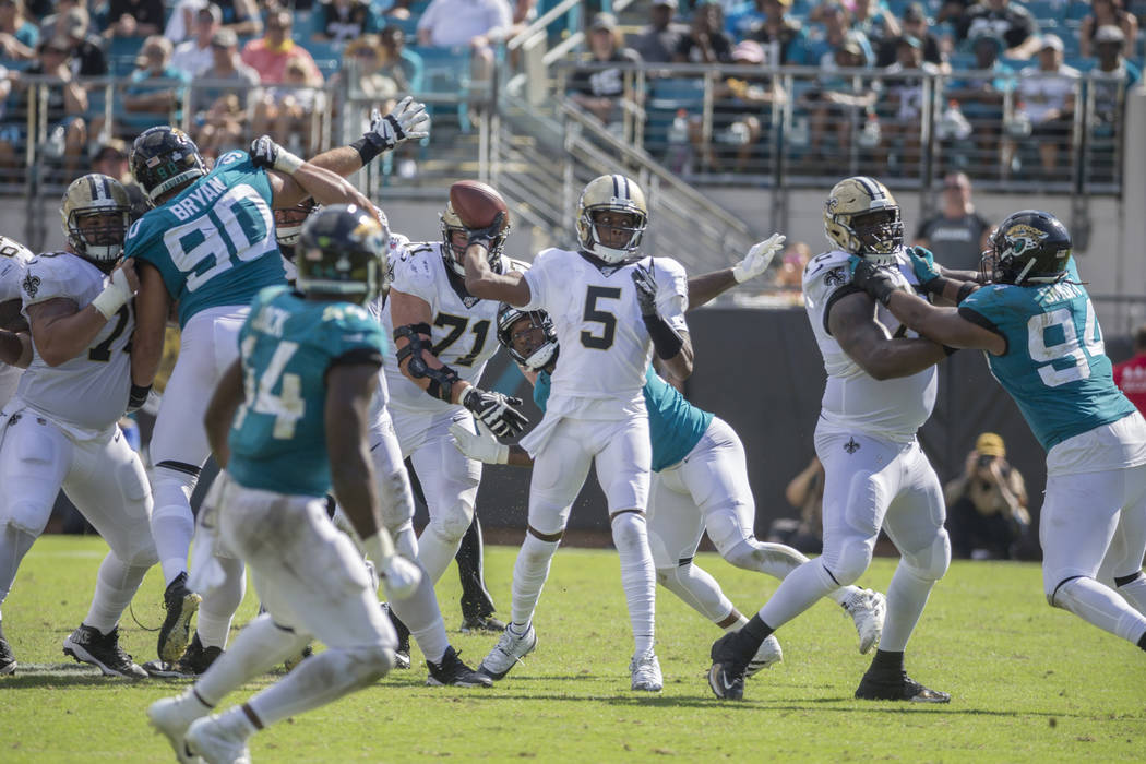 New Orleans Saints quarterback Teddy Bridgewater (5) throws a pass against the Jacksonville Jag ...