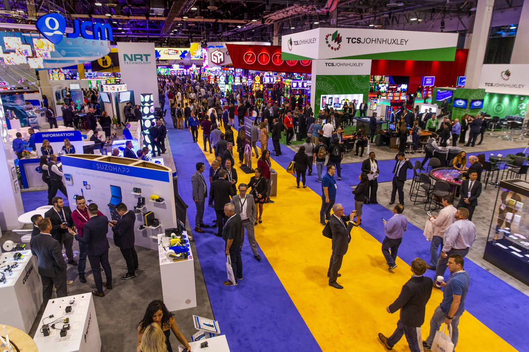 Attendees stream about the exhibition area floor during the Global Gaming Expo 2019 at the Sand ...