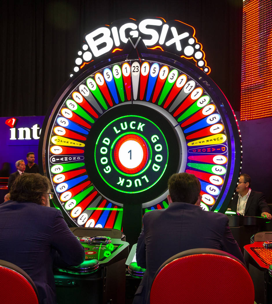 Attendees play the Big-Six automated electronic table game by Interblock during the Global Gami ...
