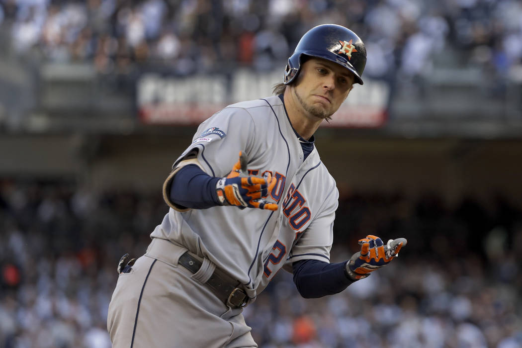 Houston Astros' Josh Reddick (22) reacts after hitting a solo home run against the New York Yan ...