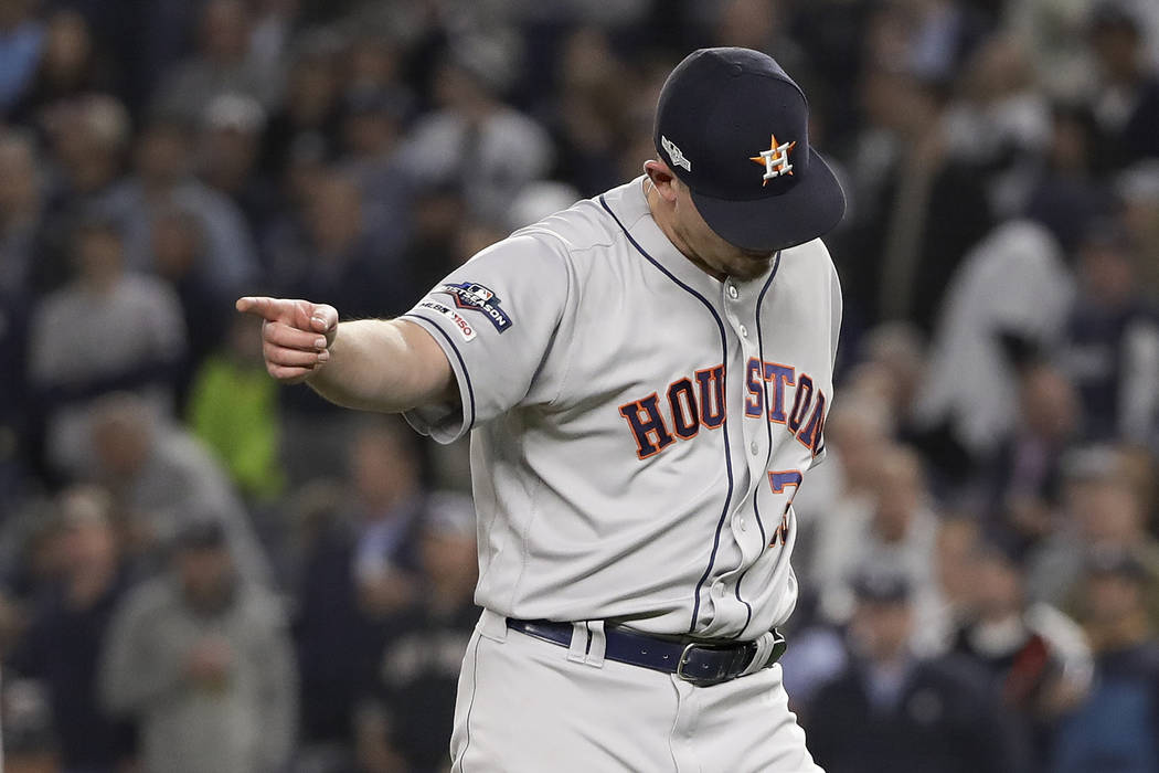 Houston Astros relief pitcher Will Harris (36) motions to teammates at the end of the eighth in ...
