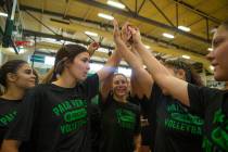 The varsity volleyball team go in for a huddle before a break during volleyball practice at Pal ...