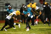 Silverado's Aginae Cunningham (2) runs the ball against Clark during the first half of a footba ...