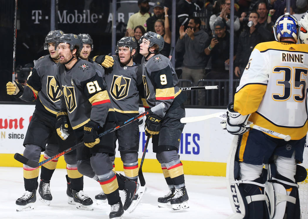 Vegas Golden Knights right wing Mark Stone (61) celebrates with teammates after scoring a goal ...