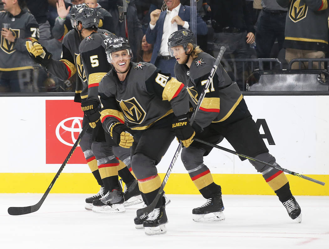 Vegas Golden Knights center Jonathan Marchessault (81) celebrates with teammates after assistin ...