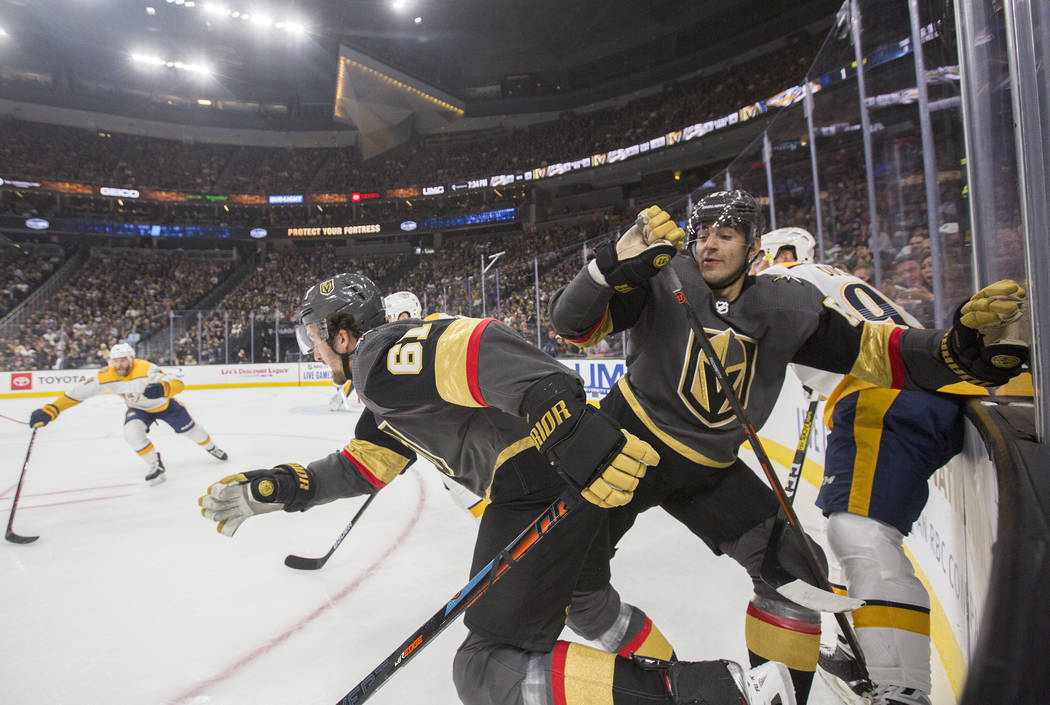 Vegas Golden Knights right wing Mark Stone (61) and Vegas Golden Knights left wing Max Pacioret ...