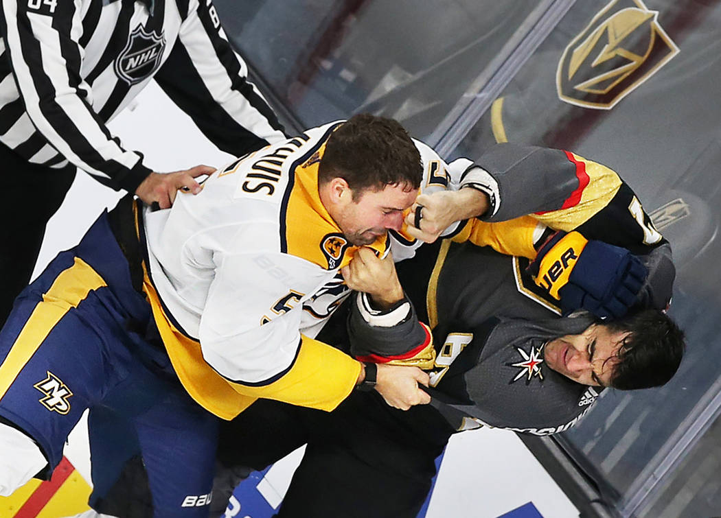 Vegas Golden Knights left wing Max Pacioretty (67) fights Nashville Predators defenseman Dan Ha ...