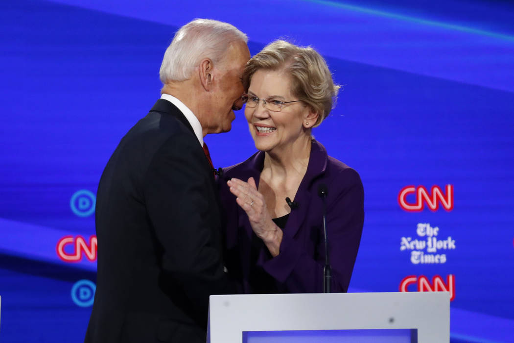 Democratic presidential candidate former Vice President Joe Biden, left, talks with Sen. Elizab ...