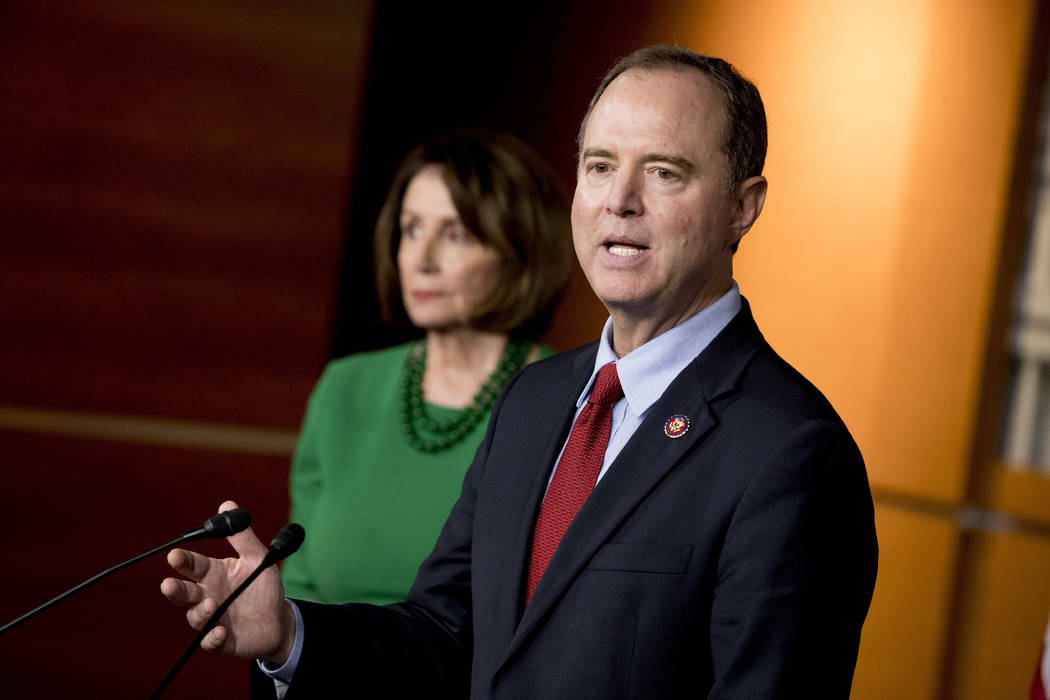 Rep. Adam Schiff, D-Calif., Chairman of the House Intelligence Committee, right, accompanied by ...