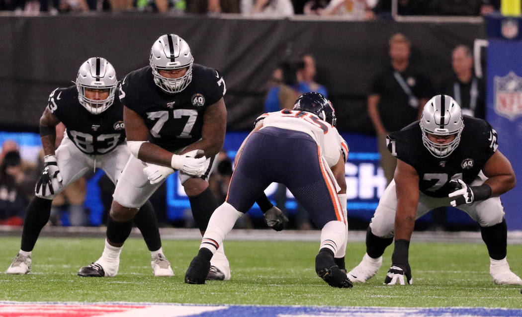 Oakland Raiders offensive tackle Trent Brown (77) and guard Denzelle Good (71) prepare to block ...