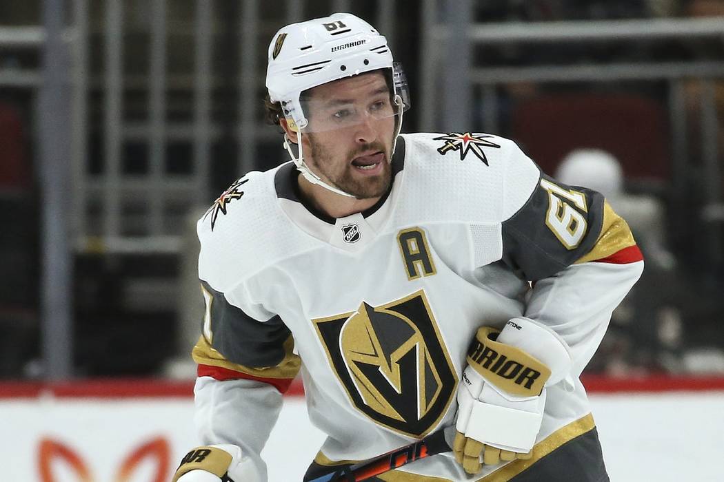 Vegas Golden Knights right wing Mark Stone skates to the puck against the Arizona Coyotes durin ...