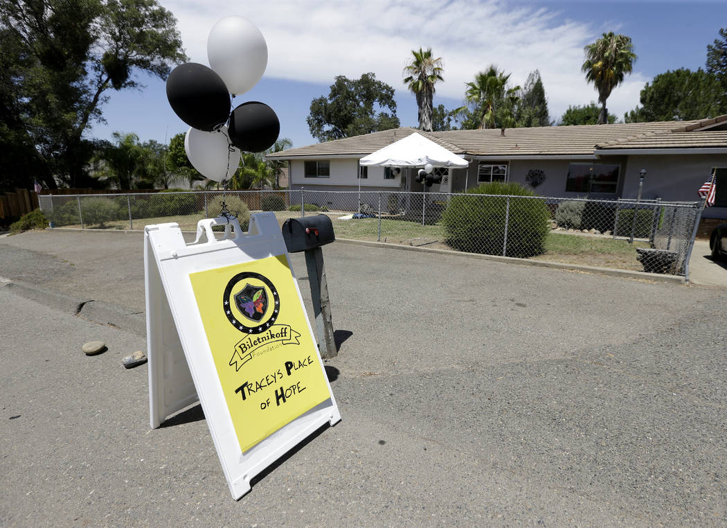 Silver and black balloons flutter in the breeze outside Tracey's Place of Hope on Thursday, Jul ...