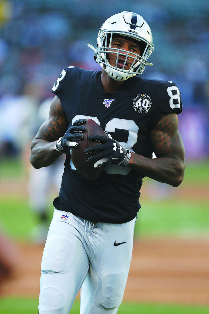 Oakland Raiders tight end Darren Waller runs the ball during an NFL football game against the D ...
