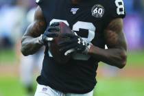 Oakland Raiders tight end Darren Waller runs the ball during an NFL football game against the D ...