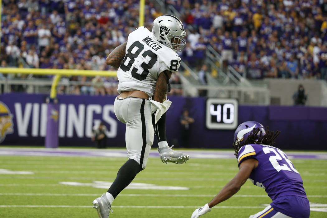 Oakland Raiders tight end Darren Waller (83) catches a pass over Minnesota Vikings cornerback T ...